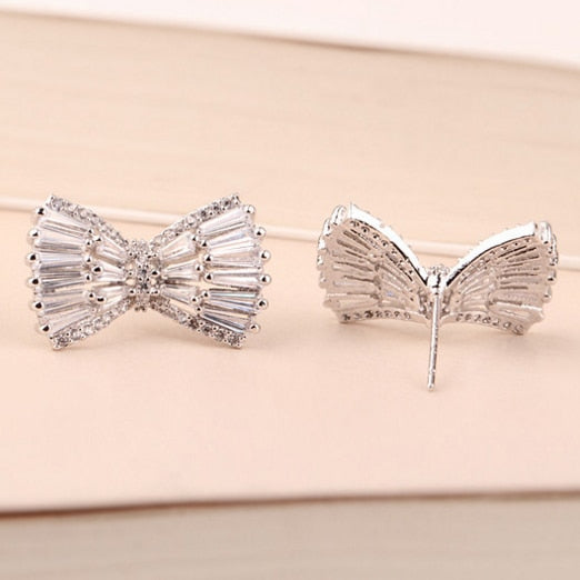 JEIKA | עגילי פפיון צמודות באבני זירקון בגטים