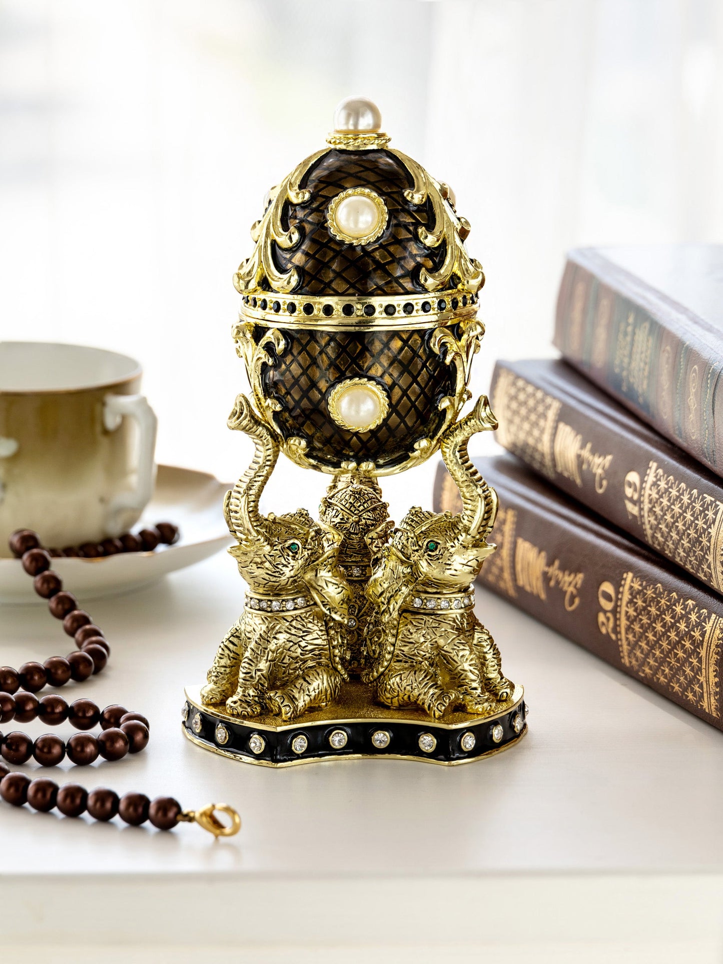 Regal Brown and Gold Enamel Egg with Elephant Pedestal
