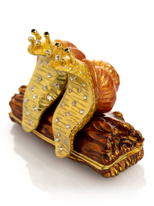 Keren Kopal Snails Sitting on a Log